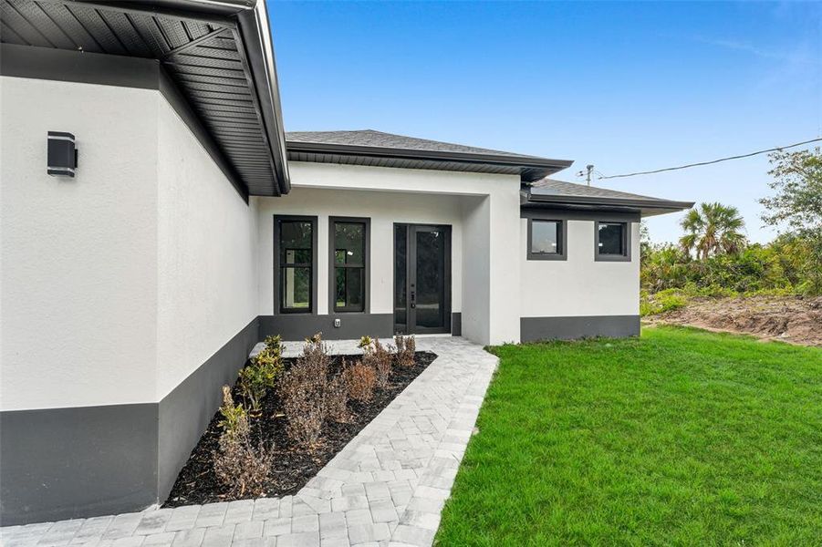 Front exterior of a new home in , Englewood, FL, highlighting curb appeal (Image 16).