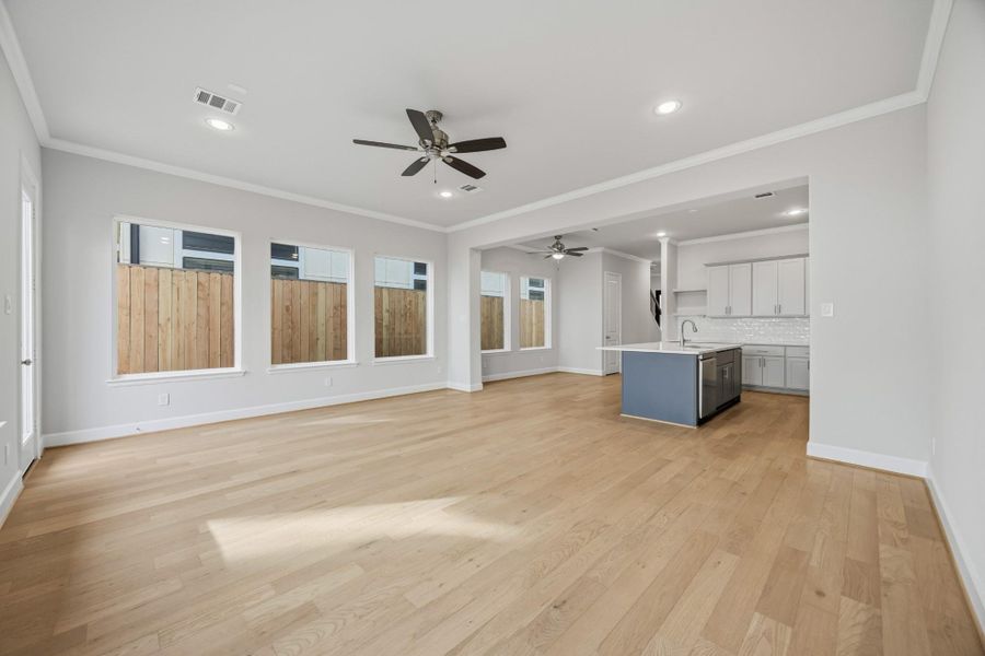 So Much Space to Relax & Entertain This wide-angle view shows off the magic of first-floor living—kitchen, dining, and living all connected in one beautifully cohesive space. So Much Space to Relax & Entertain This wide-angle view shows off the magic of first-floor living—kitchen, dining, and living all connected in one beautifully cohesive space.