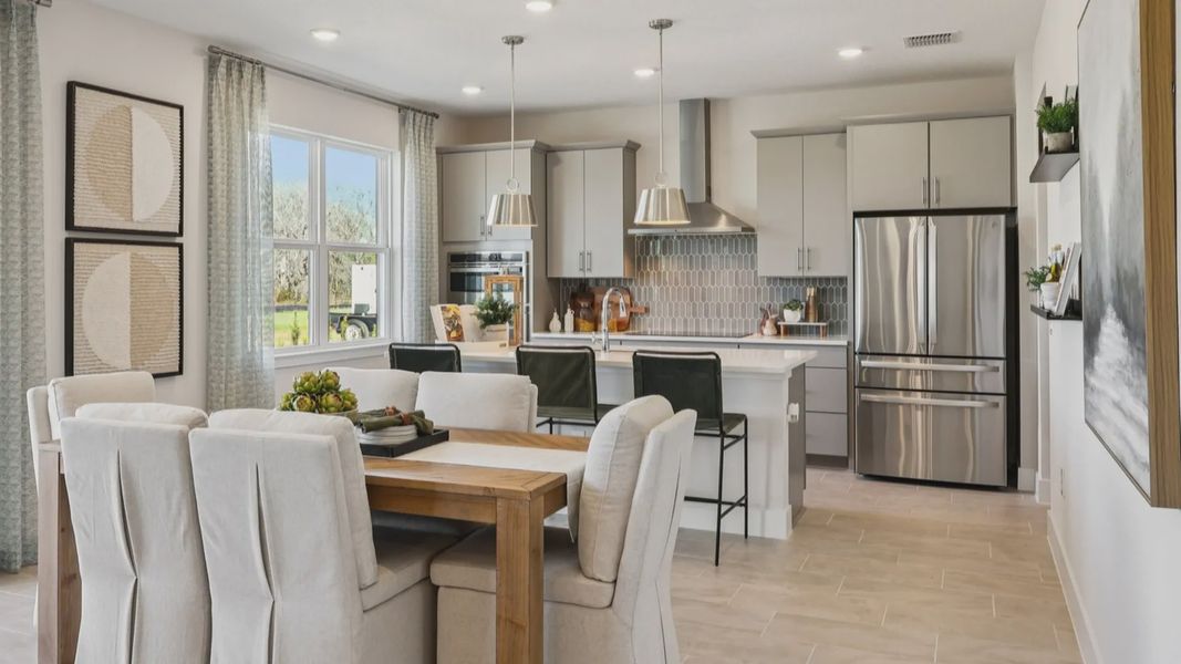 The Mangrove Model Open Concept Kitchen and Dining Area at Lakeside at Satilla by DRB Homes in Saint Cloud, FL The Mangrove Model Open Concept Kitchen and Dining Area at Lakeside at Satilla by DRB Homes in Saint Cloud, FL