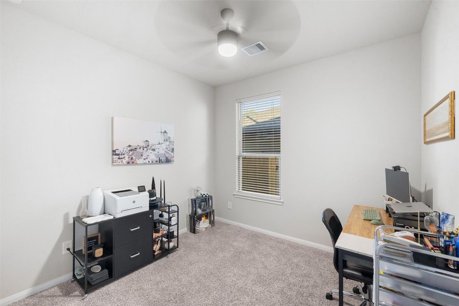 Versatile bedroom currently styled as a productive home office.