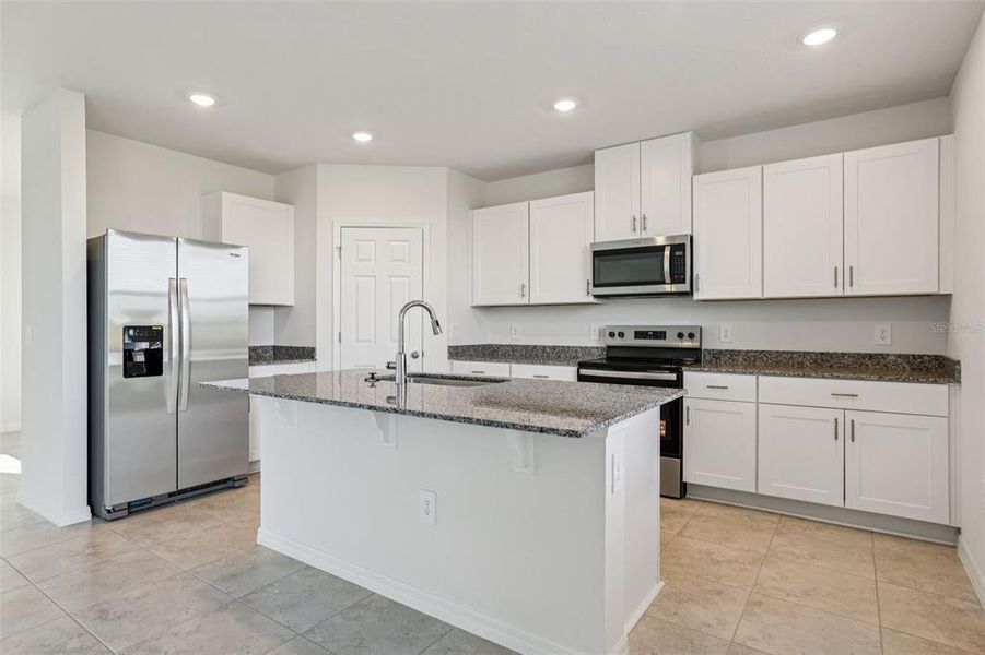 Furnished interior view inside a new home in Lake Deer Estates - Signature Series, Poinciana (Image 8).
