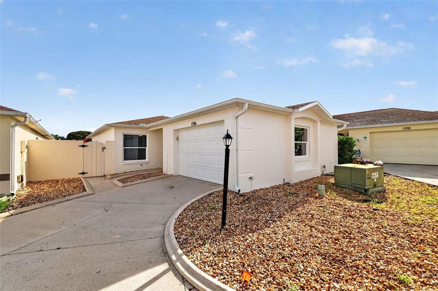 Front exterior of a new home in , The Villages, FL, highlighting curb appeal (Image 19).