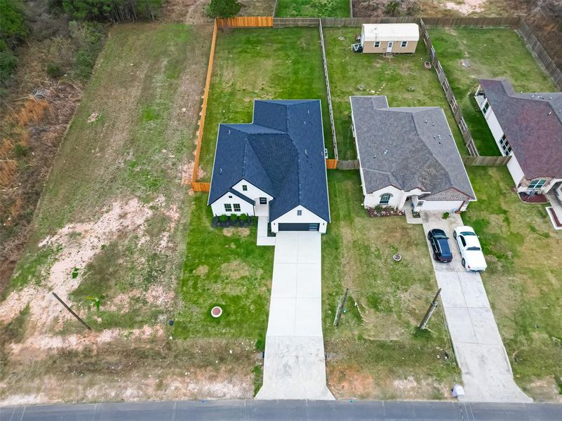 Appreciate the spacious long driveway with room for multiple cars.