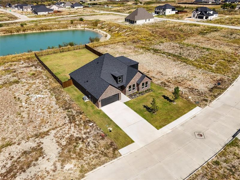 Front exterior of a new home in , Venus, TX, highlighting curb appeal (Image 18).