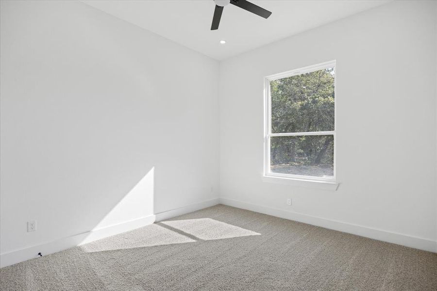 Bright Kid bedroom room featuring a single window, recessed lighting, and a ceiling fan