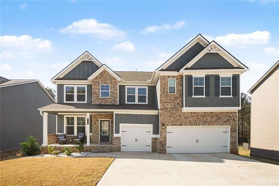 Front exterior of a new home in , Stockbridge, GA, highlighting curb appeal (Image 1). Front exterior of a new home in , Stockbridge, GA, highlighting curb appeal (Image 1).