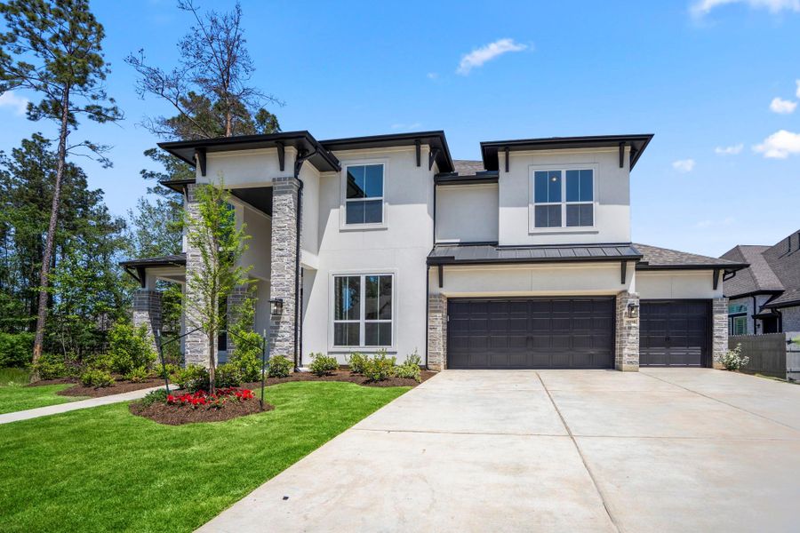 Front exterior of a new home in Artavia 70′ Lots, Conroe, TX, highlighting curb appeal (Image 1).