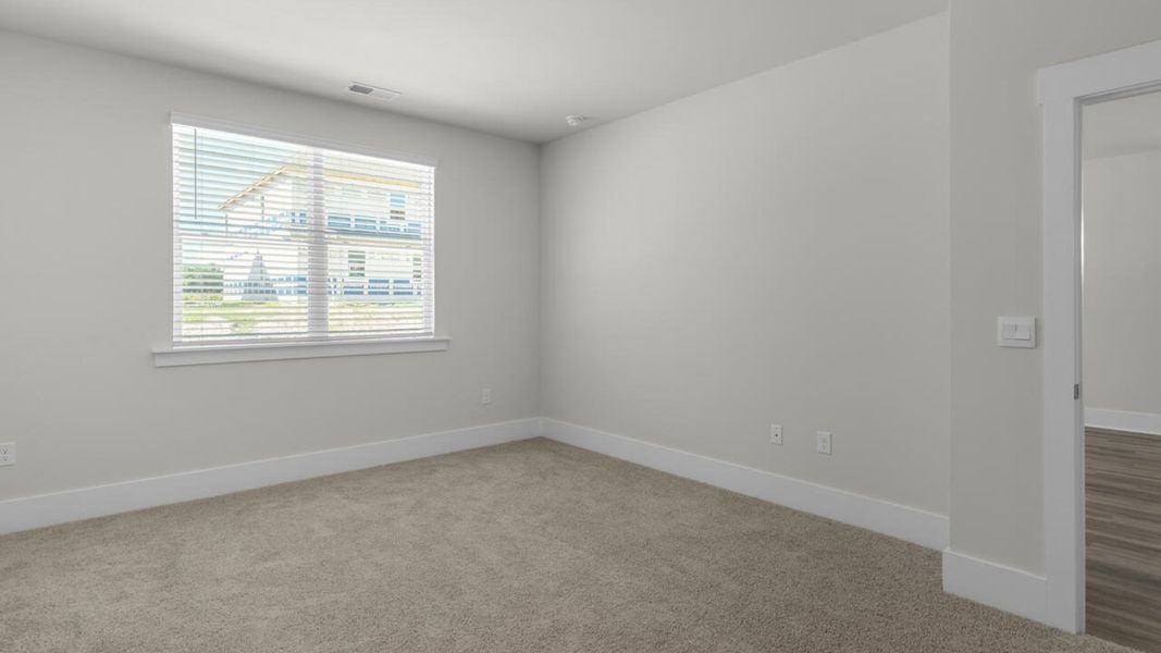 Spacious, unfurnished interior of a new home in Surfside Landing, Hubert (Image 19).
