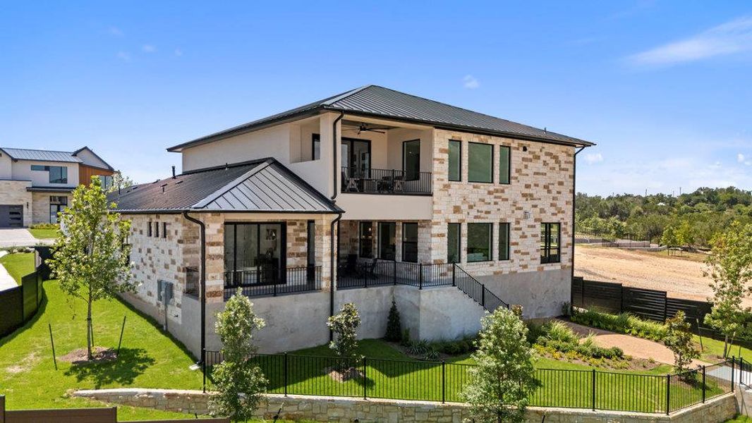 Exterior details and patio area of a home in Milky Way at River Place, Austin (Image 3).