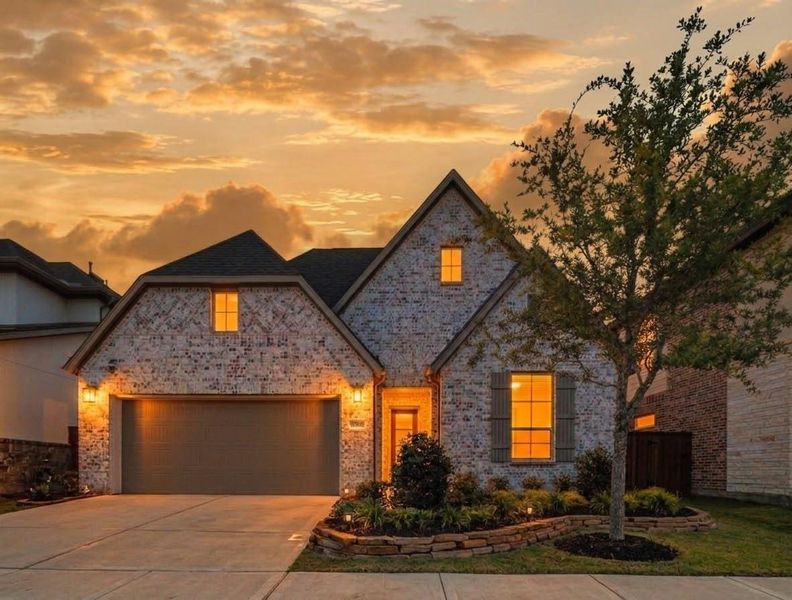 Front exterior of a new home in Tompkins Reserve, Katy, TX, highlighting curb appeal (Image 23). Front exterior of a new home in Tompkins Reserve, Katy, TX, highlighting curb appeal (Image 23).