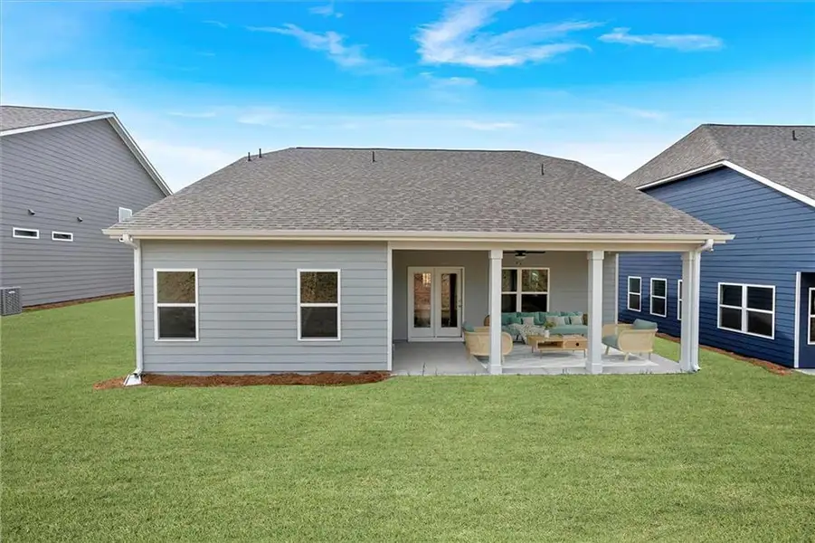 Exterior details and patio area of a home in Heritage Pointe at The Georgian, Villa Rica (Image 3).