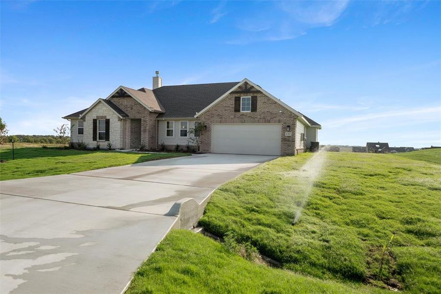 Front exterior of a new home in Fairview Meadows, New Fairview, TX, highlighting curb appeal (Image 24). Front exterior of a new home in Fairview Meadows, New Fairview, TX, highlighting curb appeal (Image 24).
