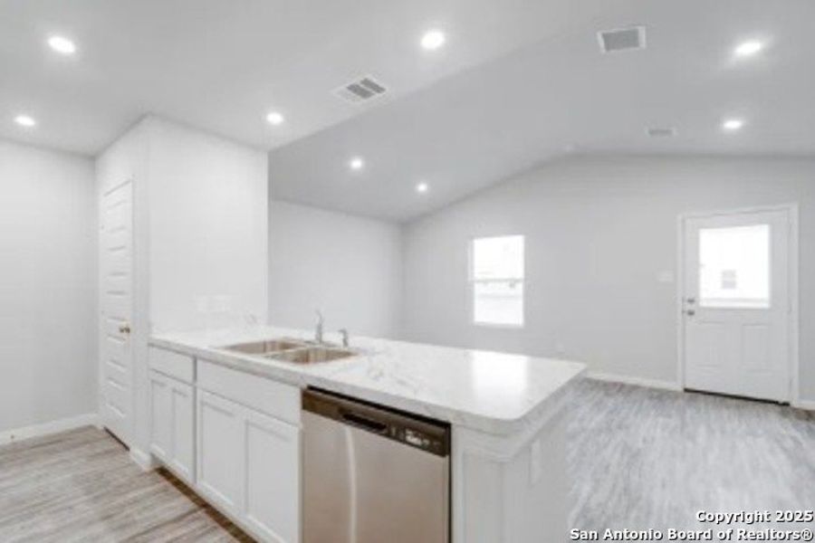 Furnished interior view inside a new home in Las Colinas, Kenedy (Image 5).