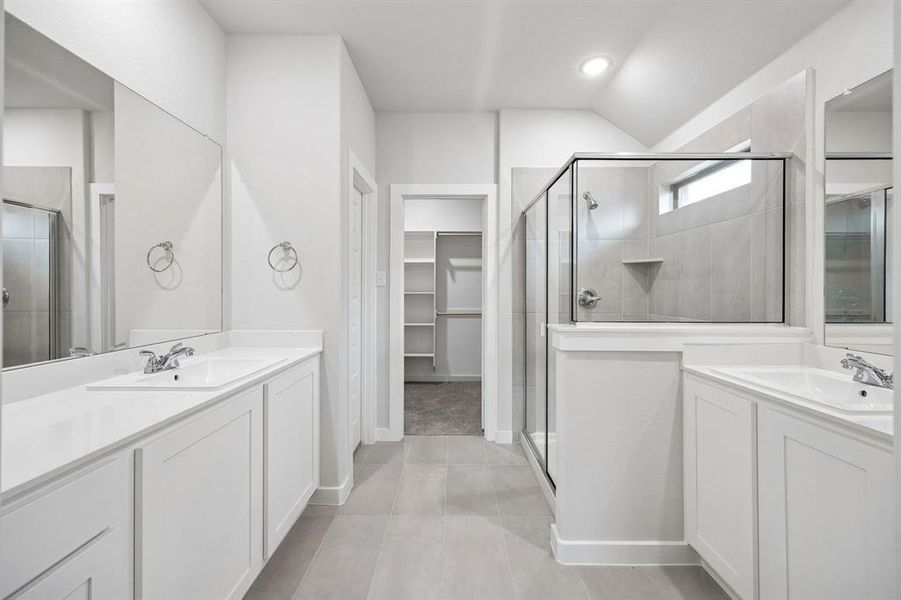 Primary Bathroom in the Heisman home plan by Trophy Signature Homes – REPRESENTATIVE PHOTO