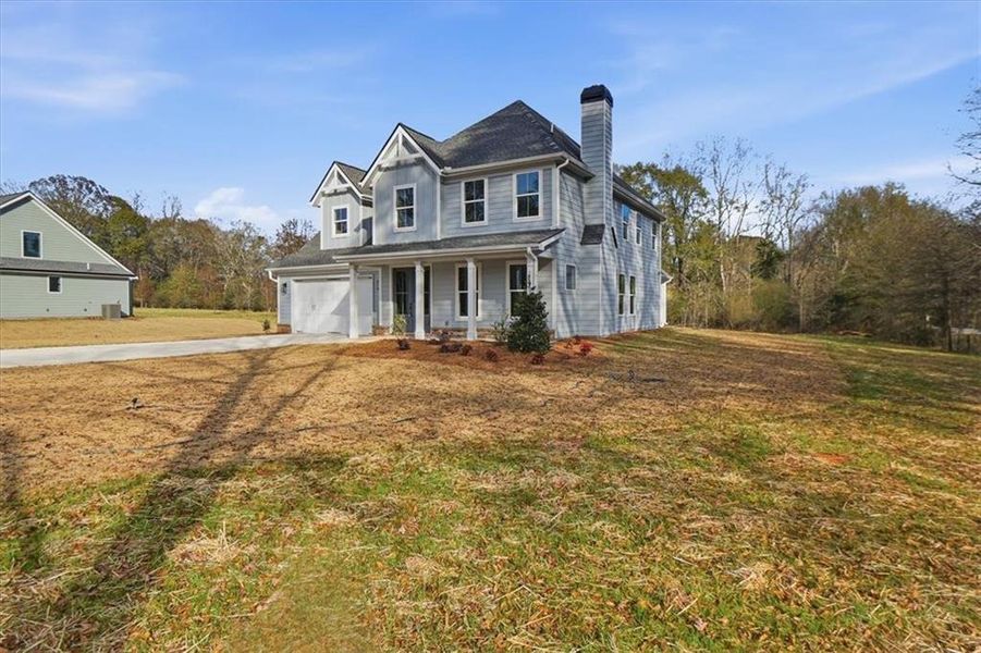 Front exterior of a new home in , Statham, GA, highlighting curb appeal (Image 32). Front exterior of a new home in , Statham, GA, highlighting curb appeal (Image 32).