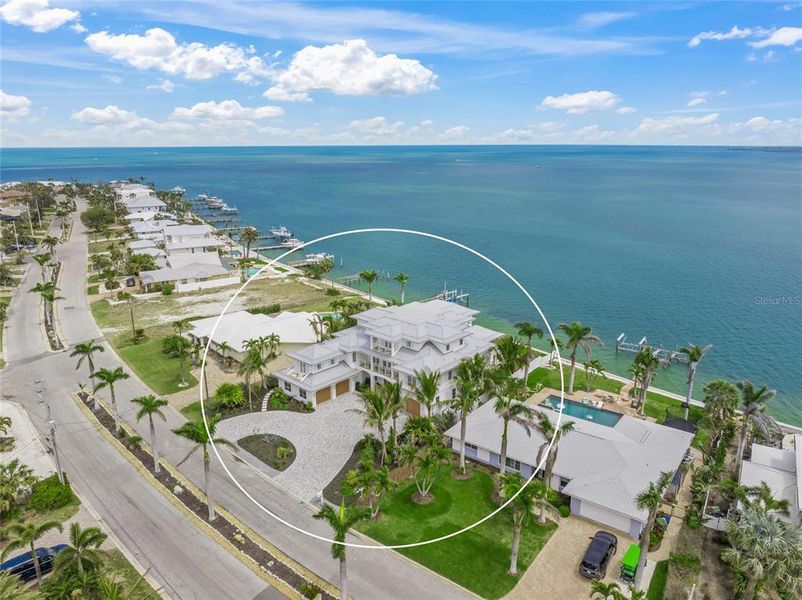 Front exterior of a new home in , Holmes Beach, FL, highlighting curb appeal (Image 2). Front exterior of a new home in , Holmes Beach, FL, highlighting curb appeal (Image 2).