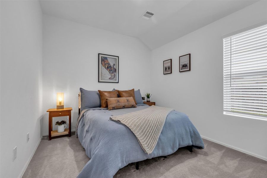 This is one of the bedrooms in this 3 bedroom  home. A good size for any family member or guest.