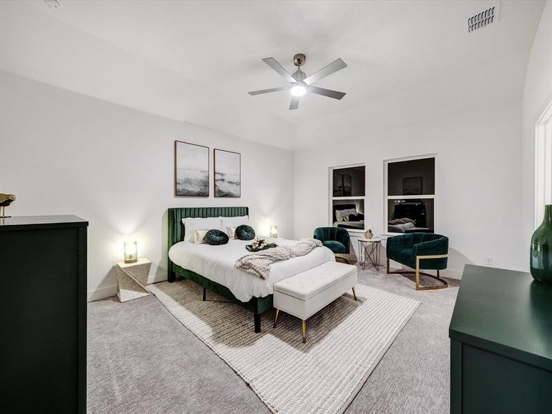 Bedroom featuring carpet and a ceiling fan Bedroom featuring carpet and a ceiling fan