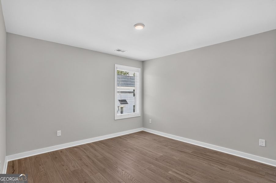 Spacious, unfurnished interior of a new home in The Cottages at East Lanier, Fayetteville (Image 17).