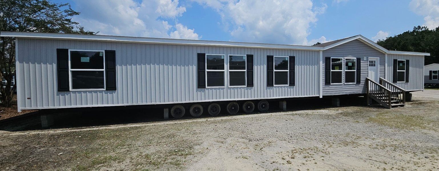 Front exterior of a new home in , Cottageville, SC, highlighting curb appeal (Image 2).