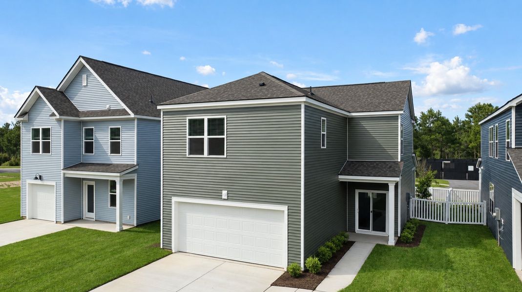 Front exterior of a new home in The Cove at Mallard Crossing, Summerville, SC, highlighting curb appeal (Image 16). Front exterior of a new home in The Cove at Mallard Crossing, Summerville, SC, highlighting curb appeal (Image 16).