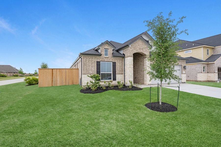 Front exterior of a new home in Beacon Hill, Waller, TX, highlighting curb appeal (Image 20).