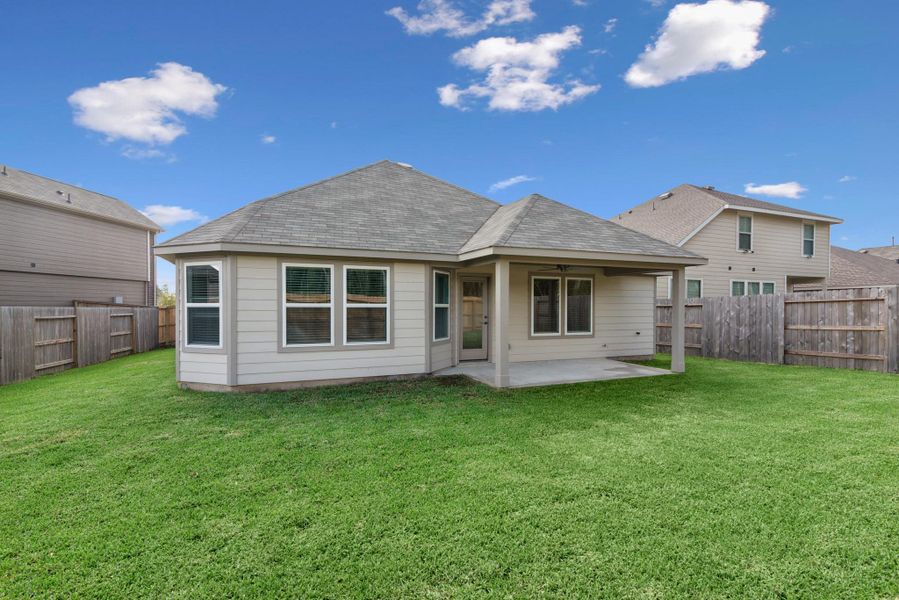 Exterior details and patio area of a home in Pinewood at Grand Texas, New Caney (Image 1).