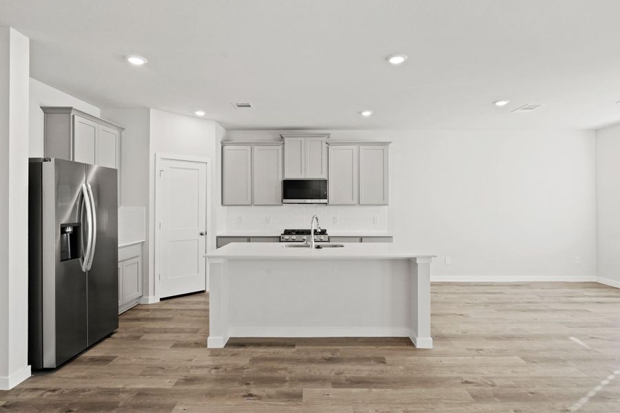 Furnished interior view inside a new home in Woodshore, Clute (Image 9).