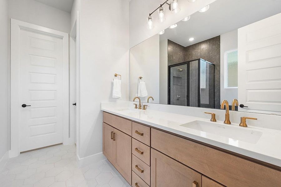 Clean lines and a spacious dual vanity highlight this contemporary master bathroom.