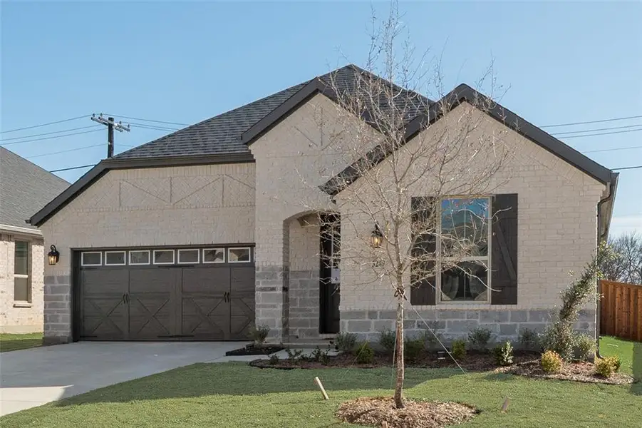 Front exterior of a new home in Villages of Hurricane Creek, Anna, TX, highlighting curb appeal (Image 1). Front exterior of a new home in Villages of Hurricane Creek, Anna, TX, highlighting curb appeal (Image 1).