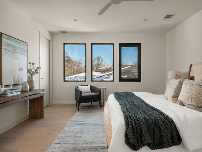 Bedroom featuring light wood finished floors and ceiling fan