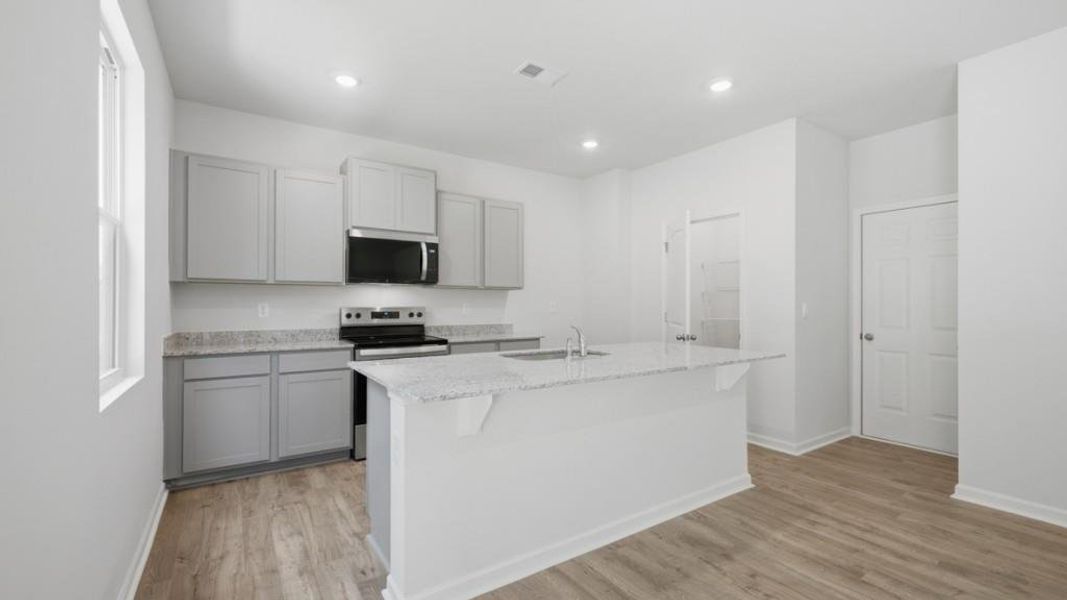 Furnished interior view inside a new home in Oaks at Cedar Grove, Fairburn (Image 8).