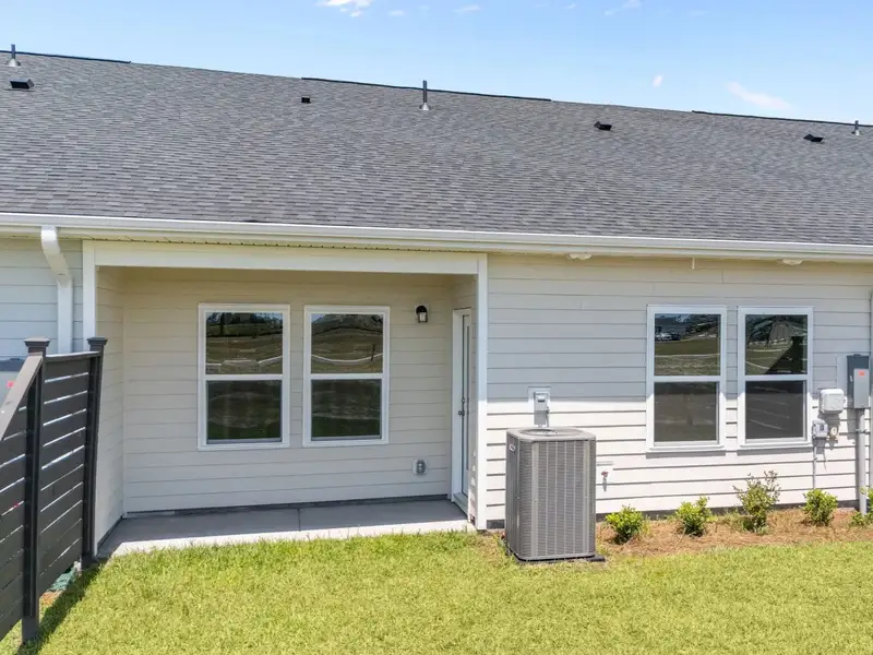 Exterior details and patio area of a home in Blue Heron Retreat, Little River (Image 3).