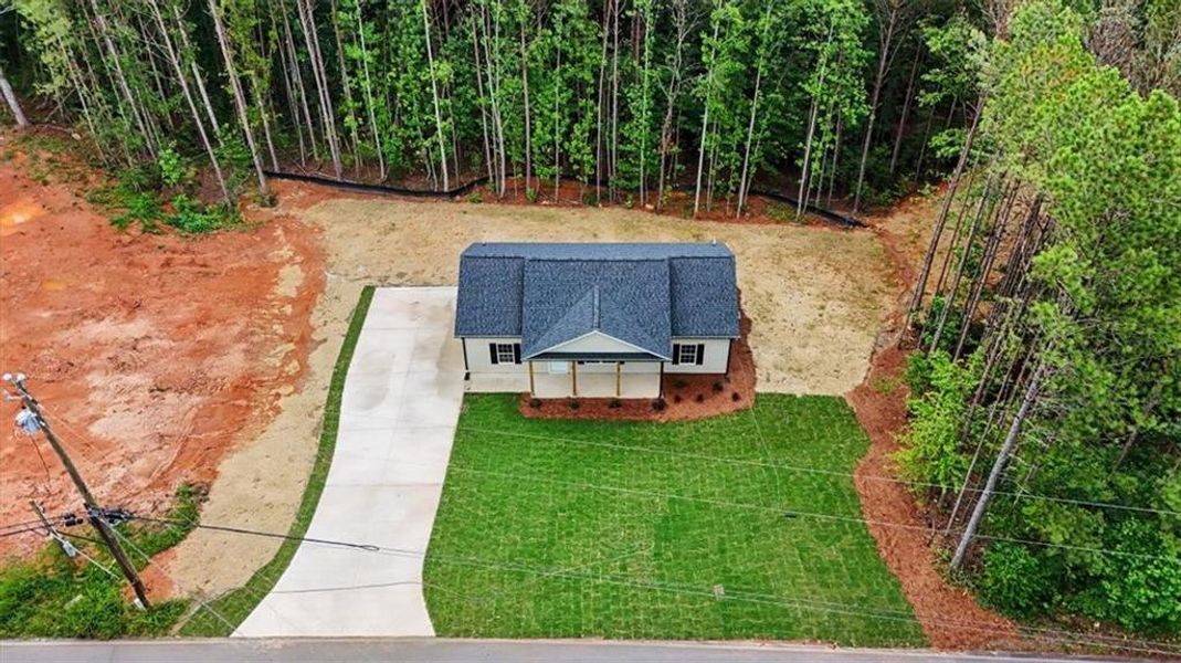 Front exterior of a new home in , Temple, GA, highlighting curb appeal (Image 2). Front exterior of a new home in , Temple, GA, highlighting curb appeal (Image 2).