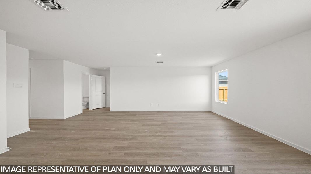 Spare room featuring light wood finished floors and recessed lighting