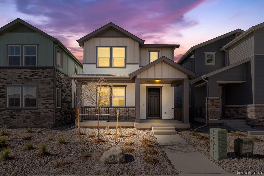 Front exterior of a new home in Painted Prairie, Aurora, CO, highlighting curb appeal (Image 1). Front exterior of a new home in Painted Prairie, Aurora, CO, highlighting curb appeal (Image 1).