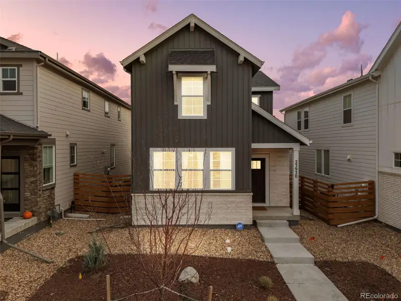 Front exterior of a new home in The Aurora Highlands Horizon Collection, Aurora, CO, highlighting curb appeal (Image 2).