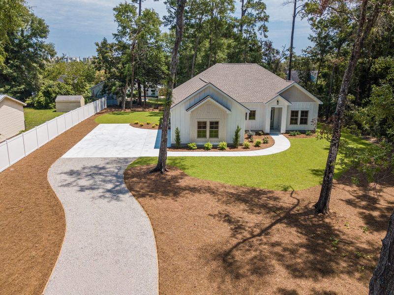 Front exterior of a new home in , Pawleys Island, SC, highlighting curb appeal (Image 2). Front exterior of a new home in , Pawleys Island, SC, highlighting curb appeal (Image 2).