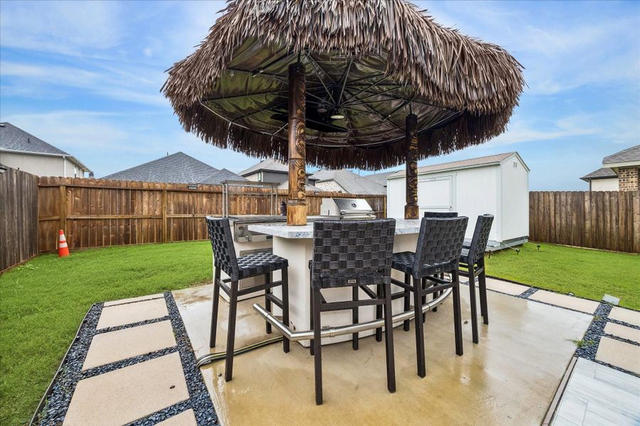 This backyard is ready for its next chapter, with the tiki bar setup being removed by the current seller while the wiring, concrete base & plumbing remain in place. The space is primed for the next owner to create their own outdoor entertaining retreat, custom bar, grill station or backyard hangout. You are welcome to visit Paradise Grills where you can get your own!
