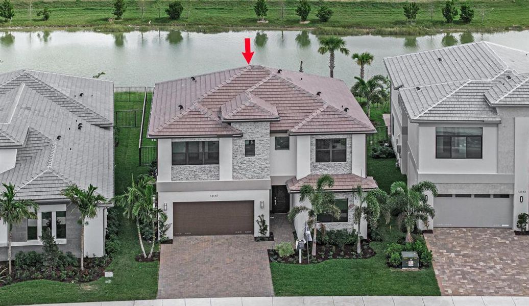 Front exterior of a new home in Apex at Avenir, Palm Beach Gardens, FL, highlighting curb appeal (Image 25).
