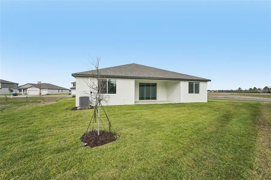 Exterior details and patio area of a home in Oakfield Trails - Signature Series, Parrish (Image 3).