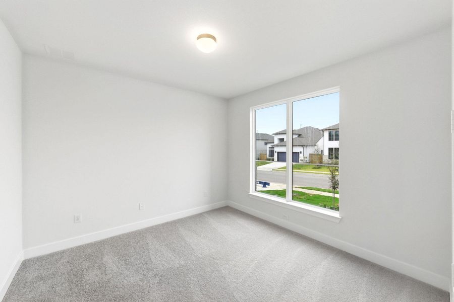 Spacious, unfurnished interior of a new home in The Colony, Bastrop (Image 32).