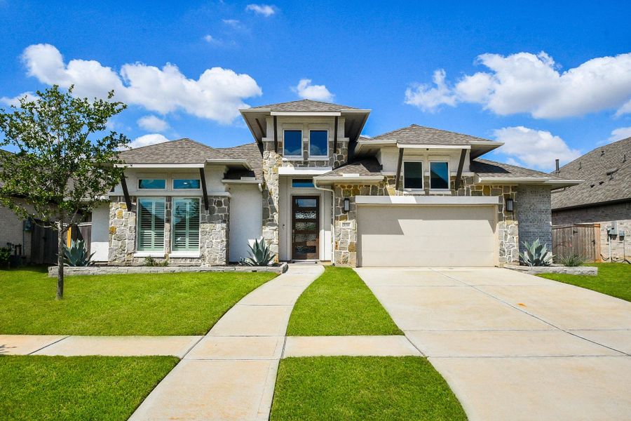 Upgraded elevation and low maintenance landscape await you!