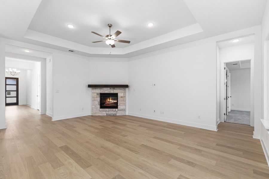 Family Room with tray ceiling & fireplace