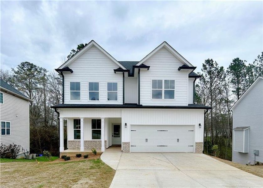Front exterior of a new home in , Cartersville, GA, highlighting curb appeal (Image 17).