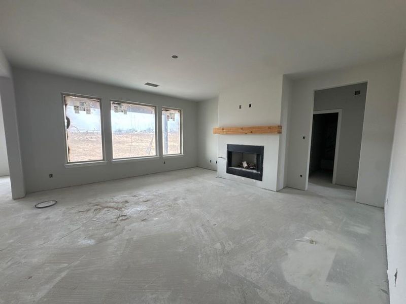 Unfurnished living room with a fireplace