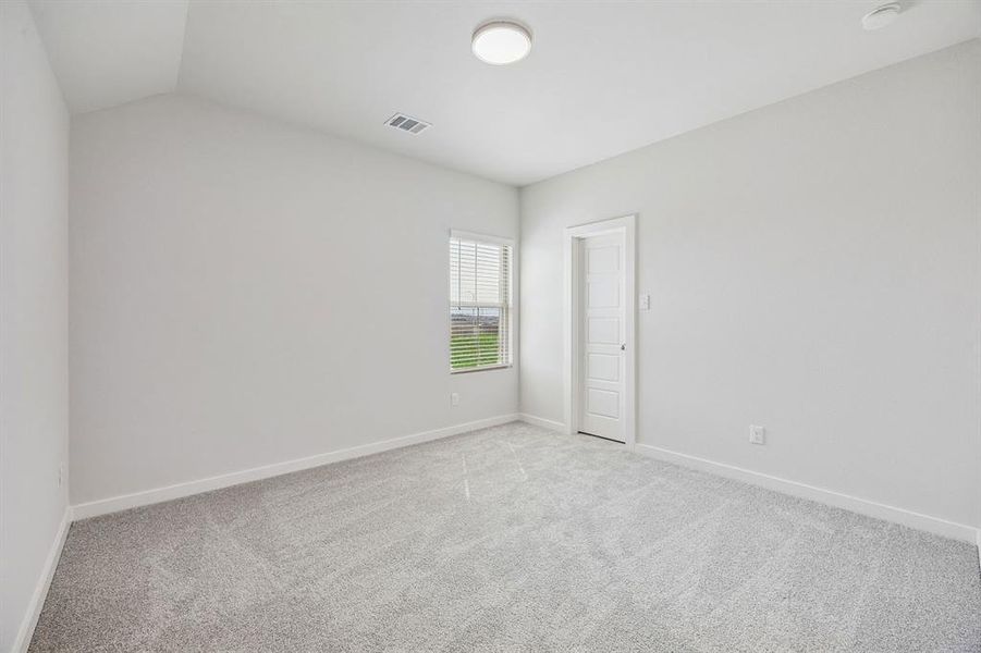 Bedroom in the Stanley II home plan by Trophy Signature Homes – REPRESENTATIVE PHOTO