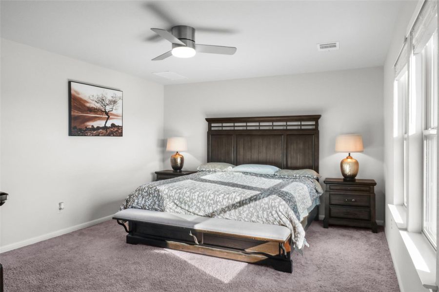 Bedroom with carpet floors and ceiling fan