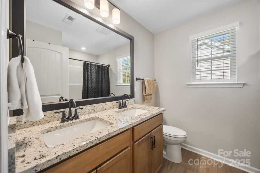 Guest Bath with dual sinks and shower/tub combo. Guest Bath with dual sinks and shower/tub combo.