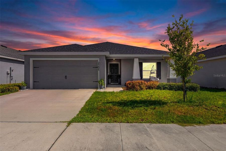 Front exterior of a new home in Astonia, Davenport, FL, highlighting curb appeal (Image 22). Front exterior of a new home in Astonia, Davenport, FL, highlighting curb appeal (Image 22).